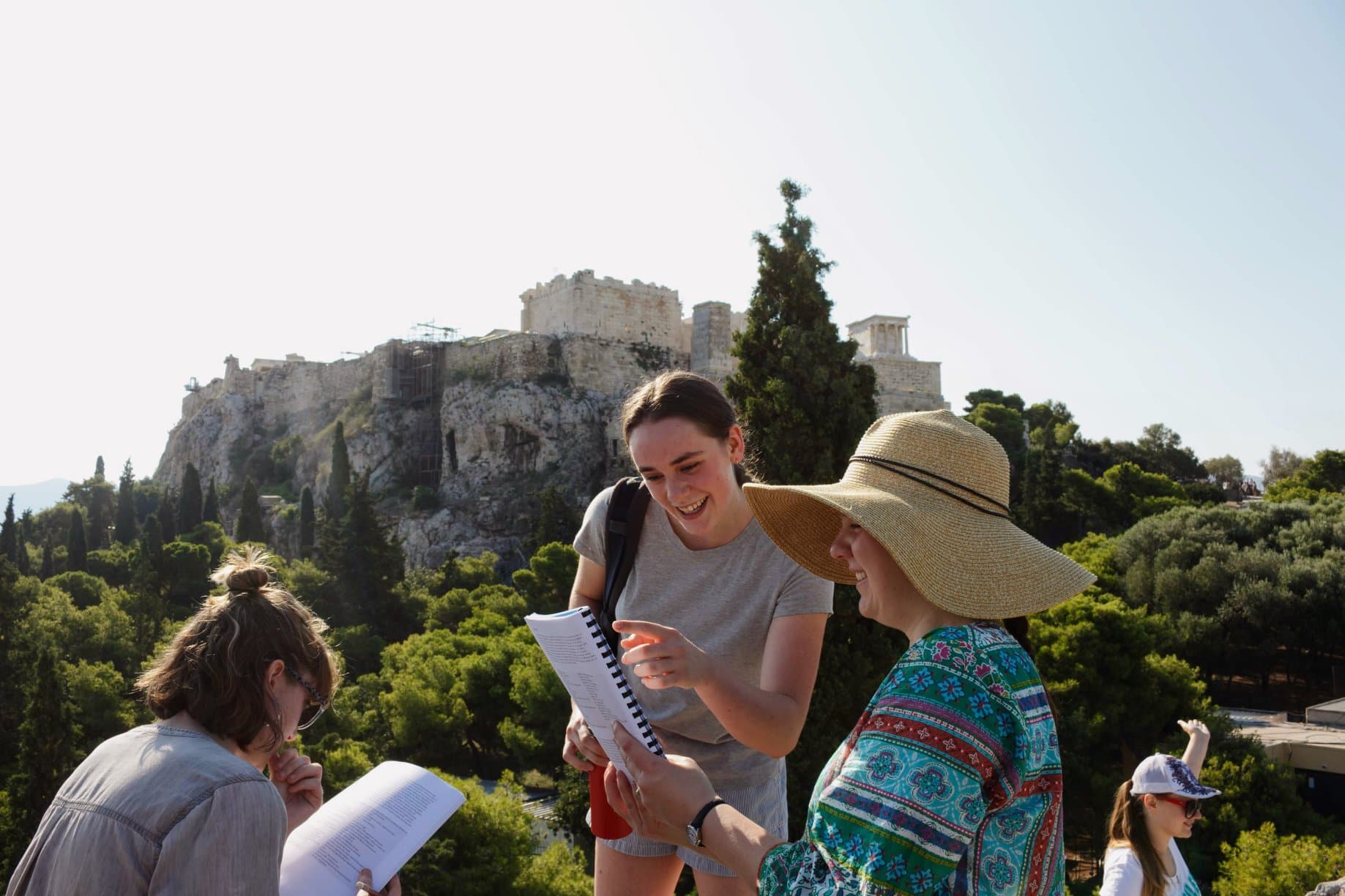 Reading Ancient Greek at the foot of the Athenian Acropolis
